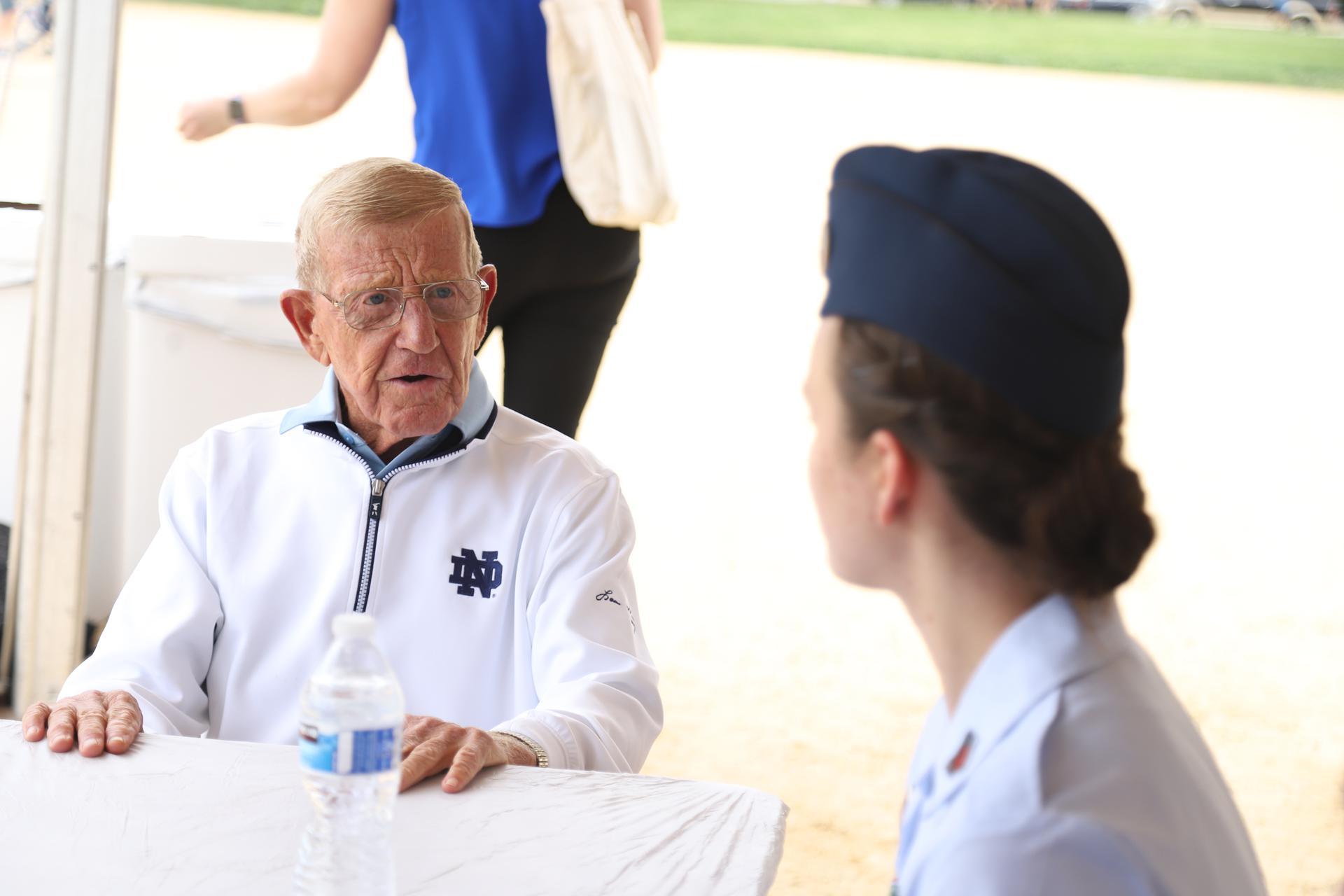 Lou speaking with a soldier at the 2019 Memorial Day Parade